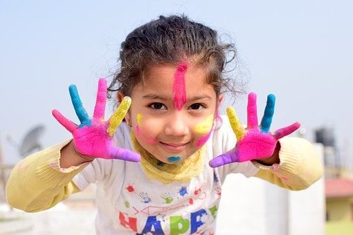 Joyful Child with Colorful Hands